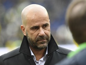 Dortmund's coach Peter Bosz arrives ahead of the Bundesliga soccer match between Hannover 96 and Borussia Dortmund in the HDI Arena in Hannover, Germany, Saturday, Oct. 28, 2017.  (Peter Steffen/dpa via AP)