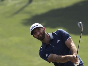 World number one golfer Dustin Johnson hits from the fairway at the third round of the 2017 WGC-HSBC Champions golf tournament held at the Sheshan International Golf Club in Shanghai, China, Saturday, Oct. 28, 2017. (AP Photo/Ng Han Guan)