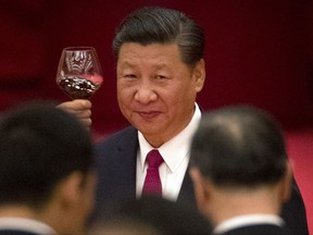 FILE - In this Sept. 30, 2017 file photo, Chinese President Xi Jinping toasts during a reception at the Great Hall of the People on the eve of the Oct. 1 National Day holiday in Beijing. Under President Xi, China's ruling Communist Party is reasserting itself after years of waning influence over the daily affairs of its citizens, even while it maintained an iron grip on the military and political system. Those efforts will likely get a boost when the party meets for its national congress, when Xi is expected to receive a second term as party leader. (AP Photo/Mark Schiefelbein, File)