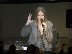 Journalists listen to a video stream of a news conference of Russian celebrity Ksenia Sobchak, who announced her presidential bid last week, in Moscow, Russia, on Tuesday, Oct. 24, 2017. A 35-year-old Russian celebrity TV host who wants to become a presidential candidate opened her first news conference on Tuesday by demanding the release of all political prisoners. (AP Photo/Ivan Sekretarev)