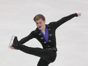 Mikhail Kolyada, of Russia, skates his free program at the Rostelekom Cup ISU Grand Prix figure skating event in Moscow, Russia, on Saturday, Oct. 21, 2017. (AP Photo/Ivan Sekretarev)