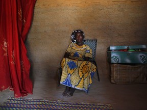 FILE- In this Friday, July 20, 2012, file photo, Aicha, 14, poses in her bedroom in the remote village of Kaihi, Niger. Child marriage affects nearly 15 million girls around the world, and West and Central Africa has six of the 10 countries with the highest rate. (AP Photo/Jerome Delay, File)