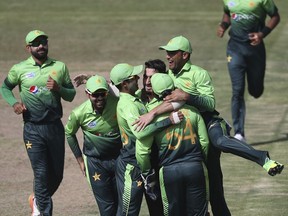 Pakistan'n players celebrate dismissal of Sri Lanka's Upul Tharanga during their third ODI cricket match in Sharjah, United Arab Emirates, Friday, Oct. 20, 2017. (AP Photo/Kamran Jebreili)