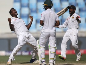 Sri Lanka's Lahiru Gamage celebrates dismissal of Pakistan's Asad Shafiq during their last day at Second Test cricket match against Pakistan in Dubai, United Arab Emirates, Tuesday, Oct. 10, 2017. (AP Photo/Kamran Jebreili)