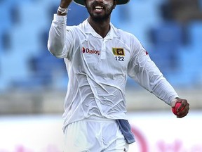 Sri Lanka's captain Dinesh Chandimal celebrates after he catches the final ball during their last day at Second Test cricket match against Pakistan in Dubai, United Arab Emirates, Tuesday, Oct. 10, 2017. (AP Photo/Kamran Jebreili)