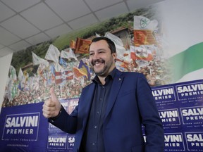 Northern League leader Matteo Salvini gives the thumbs up to reporters as he arrives for a news conference at the party headquarters, in Milan, Italy, Monday, Oct. 23, 2017. The presidents of Italy's wealthy northern regions of Veneto and Lombardy on Sunday claimed victory in autonomy referendums that seek to grab additional powers and tax revenue from Rome, riding a global tide of self-determination that has swamped Spain's Catalonia region. (AP Photo/Luca Bruno)