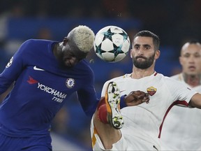 Chelsea's Tiemoue Bakayoko, left, challenges for the ball with Roma's Maxime Gonalons during the Champions League group C soccer match between Chelsea and Roma at Stamford Bridge stadium in London, Wednesday, Oct. 18, 2017. (AP Photo/Kirsty Wigglesworth)