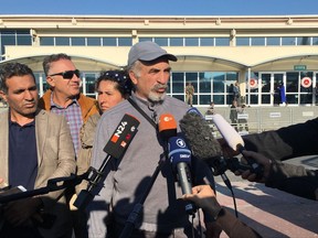 Ali Riza Tozlu, father of German journalist Mesale Tolu, talks to the media outside a court in Silivri, Turkey, Wednesday, Oct. 11, 2017. Mesale Tolu, a German citizen with Turkish roots, has appeared before a court on terror charges, the first of 11 German or German-Turkish citizens arrested in Turkey to go on trial. (AP Photo/Mehmet Guzel)