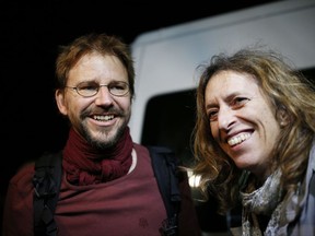 Activist Peter Steudtner, left, of Germany, smiles as he is reunited with a colleague after his release from Silivri prison outside Istanbul, early Thursday, Oct. 26, 2017. A court in Istanbul on Wednesday ordered eight human rights activists released from prison pending the outcome of their trial on charges of belonging to and aiding terror groups. The defendants were detained in a police raid while attending a digital security training workshop in July. Their cases have heightened concerns of an authoritarian turn under Turkish President Recep Tayyip Erdogan. (AP Photo/Emrah Gurel)