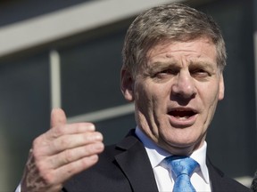 FILE - In this Aug. 24, 2017 file photo New Zealand Prime Minister Bill English gestures during a speech in Christchurch, New Zealand. New Zealanders are expecting to find out Thursday, Oct. 19, 2017 if their next prime minister will be 37-year-old liberal challenger Jacinda Ardern or 55-year-old conservative incumbent Bill English. The maverick leader of a small party which holds the balance of power said he would be making an announcement. New Zealand First leader Winston Peters is expected to declare which of the main parties he favors joining with in a coalition. (AP Photo/Mark Baker, File)