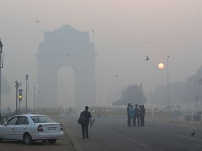 Delhi's landmark India Gate, a war memorial, is seen engulfed in morning smog a day after Diwali festival, in New Delhi, India, Friday, Oct. 20, 2017. Environmental pollution - from filthy air to contaminated water - is killing more people every year than all war and violence in the world. One out of every six premature deaths in the world in 2015 - about 9 million - could be attributed to disease from toxic exposure, according to a major study released Thursday, Oct. 19, 2017 in The Lancet medical journal. (AP Photo/Manish Swarup)