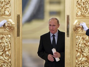 Russian President Vladimir Putin enters a hall to meet members of the Presidential Council for Civil Society and Human Rights at the Kremlin, in Moscow, Russia, Monday, Oct. 30, 2017. (Kirill Kudryavtsev/Pool photo via AP)