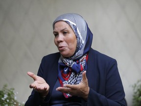 Latifa Ibn Ziaten, mother of Mohammed Merah's first victim, answers the Associated Press in Paris, Friday, Sept. 29, 2017. Soon after Mohammed Merah's life ended in a torrent of explosions and bullets, Ibn Ziaten swore she would devote her life to ensuring that no other parents would suffer as she had. But since the March 2012 attacks on a Jewish school and paratroopers left seven people dead, France has endured a seemingly endless series of attacks and near-misses from homegrown extremists with the same backstory. (AP Photo/Michel Euler)