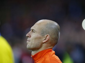 Netherland's Arjen Robben stands during the national anthem prior to the start of a World Cup Group A soccer qualifying match between the Netherlands and Sweden at the ArenA stadium in Amsterdam, Netherlands, Tuesday, Oct. 10, 2017. (AP Photo/Peter Dejong)