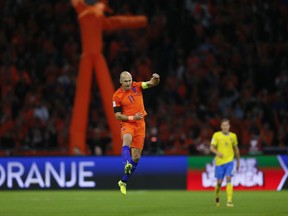 Netherland's Arjen Robben celebrates after scoring the opening goal on a penalty during a World Cup Group A soccer qualifying match between the Netherlands and Sweden at the ArenA stadium in Amsterdam, Netherlands, Tuesday, Oct. 10, 2017. (AP Photo/Peter Dejong)