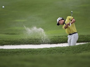 Michael Kim of United States hits out of the sand trap during the second day of the CIMB Classic golf tournament at Tournament Players Club (TPC) in Kuala Lumpur, Malaysia, Friday, Oct. 13, 2017. (AP Photo/Sadiq Asyraf)