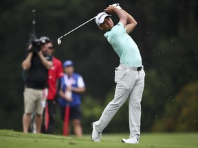 Xander Schauffele of United States in action during the second day of the CIMB Classic golf tournament at Tournament Players Club (TPC) in Kuala Lumpur, Malaysia, Friday, Oct. 13, 2017. (AP Photo/Sadiq Asyraf)