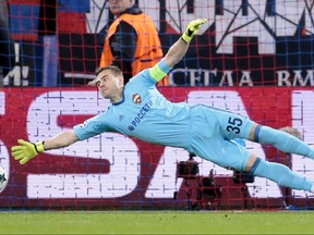 CSKA goalkeeper Igor Akinfeev fails to stop the ball during the Champions League Group A soccer match between CSKA Moscow and Basel in Moscow, Russia, Wednesday, Oct. 18, 2017. (AP Photo/Ivan Sekretarev)