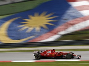 Ferrari driver Sebastian Vettel of Germany steers his car during the second practice for the Malaysian Formula One Grand Prix in Sepang, Malaysia, Friday, Sept. 29, 2017. (AP Photo/Eric To)