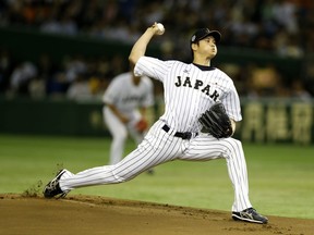 In this Nov. 19, 2015 file photo, Japanese starter Shohei Ohtani pitches against South Korea at the Premier12 world baseball tournament in Tokyo.