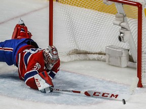Montreal Canadiens goalie Carey Price directs an errant puck away from the net in the third period against the Ottawa Senators at the Bell Centre in Montreal on Wednesday.