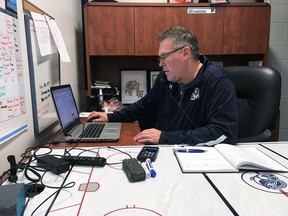 Mississauga Steelheads GM/coach James Richmond works away inside his office at the Hershey Centre.