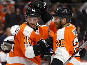 Sean Couturier of the Philadelphia Flyers, left, is the catalyst on a line with Claude Giroux, right, and Jakub Voracek.