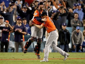Brian McCann, left, and Charlie Morton of the Houston Astros celebrate after beating the Los Angeles Dodgers 5-1 in Game 7 to win the World Series at Dodger Stadium in Los Angeles on Wednesday night.