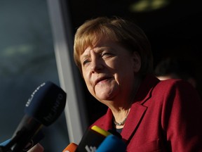 A German Chancellor and leader of the German Christian Democrats (CDU) Angela Merkel speaks to the media as she arrives for further talks the morning after leaders of the four negotiating parties failed to reach consensus over issues in their preliminary coalition talks on November 17, 2017 in Berlin, Germany.