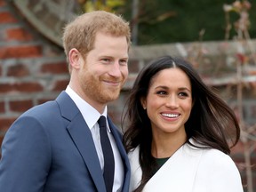 Prince Harry and actress Meghan Markle during an official photocall to announce their engagement at The Sunken Gardens at Kensington Palace on November 27, 2017 in London, England.