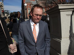White House Budget Director Mick Mulvaney, President Donald Trump's pick for acting director of the Consumer Financial Protection Bureau, walks back to the White House from the CFPB building after he showed up for his first day of work on November 27, 2017 in Washington, DC. President Trump picked Mulvaney as the acting director after former director Richard Cordray stepped down and named his chief of staff Leandra English as acting director, setting up a possible court battle over who will eventually lead the agency.