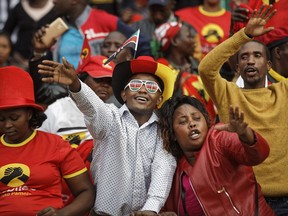 Supporters in the stand attend the presidential inauguration at Kasarani stadium in Nairobi, Kenya, Tuesday, Nov. 28, 2017. Kenyan President Uhuru Kenyatta is being sworn in on Tuesday, ending a months-long election drama that saw the first vote nullified by the country's top court and the second boycotted by the opposition. (AP Photo/Ben Curtis)