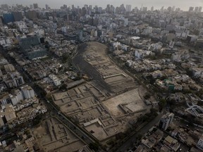 In this Oct. 10, 2017 photo, the pre-Columbian archeological site Pucllana is surrounded by urban sprawl in the Miraflores district of Lima, Peru. An estimated 46,000 pre-colonial sites mark the country's landscape, and about 400 of those are located in Lima, which has the largest number of pre-colonial archaeological zones in South America. (AP Photo/Rodrigo Abd)