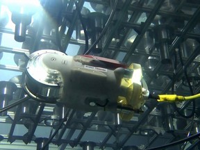 This undated handout from Japan's Toshiba and the International Research Institute for Nuclear Decommissioning (IRID) shows a remotely operated underwater vehicle (ROV), developed to inspect the interior of the Fukushima Daiichi Nuclear Plant Unit 3, which was destroyed by a tsunami after a massive earthquake on March 11, 2011. Operators practiced navigating the robot in a pool, which was meant to simulate the interior of Unit 3. The robot, 30cm in length and 13cm in diameter, is equipped with front and rear facing cameras, a 60m cable and is propelled by thrusters.