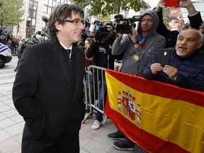 In this Oct. 31 file photo, ousted Catalan president Carles Puigdemont arrives for a press conference in Belgium.