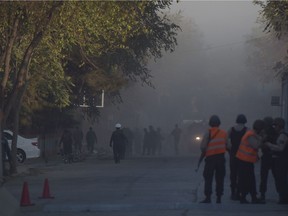 Afghan security personnel investigate the site of a suicide bombing in Wazir Akbar Khan in Kabul on October 31, 2017.