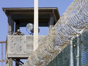 This file photo taken on April 28, 2007 shows a guard yelling down from a guard tower at Camp #4 at Camp Delta in Guantanamo Bay Naval Station, Cuba.