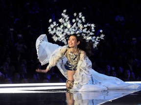 Chinese model Ming Xi falls during the 2017 Victoria's Secret Fashion Show in Shanghai on November 20, 2017.