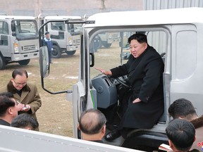 Kim Jong-Un at the Sungri Motor Complex in South Pyongan Province, in a photo release by North Korea's state-run news agency on Tuesday.