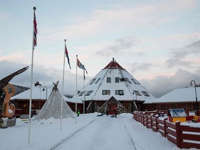 Children play in front of the Arran, the Lule Sami multi-activity centre, in the village of Drag in the Tysfjord municipality in Nordland county, Norway on November 27, 2017.