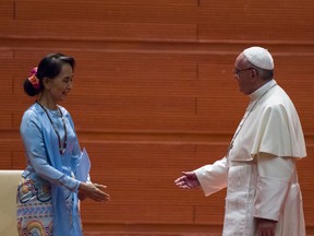 Pope Francis shakes hands with Myanmar's civilian leader Aung San Suu Kyi during an event in Naypyidaw on November 28, 2017.