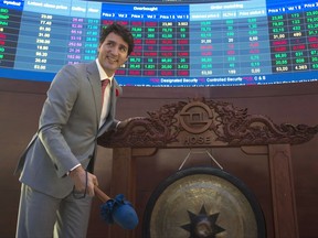 Canadian Prime Minister Justin Trudeau looks up after symbolically ringing the gong at the Ho Chi Minh City Stock Exchange in Ho Chi Minh, Vietnam Thursday November 9, 2017. THE CANADIAN PRESS/Adrian Wyld