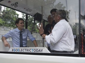Canadian Prime Minister Justin Trudeau tours an e-Jeepney during an event in Manila, Philippines on Monday, November 13, 2017. Jeepneys are the most popular means of public transportation in the Philippines. THE CANADIAN PRESS/Adrian Wyld
