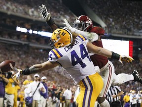 LSU fullback Tory Carter misses a pass as Alabama linebacker Shaun Dion Hamilton defends during the first half of an NCAA college football game, Saturday, Nov. 4, 2017, in Tuscaloosa, Ala. (AP Photo/Brynn Anderson)