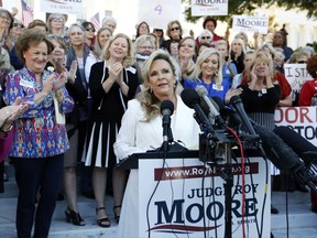 Kayla Moore, wife of former Alabama Chief Justice and U.S. Senate candidate Roy Moore, speaks at a press conference, Friday, Nov. 17, 2017, in Montgomery, Ala. Moore spoke out in defense of her husband, saying they have been married for over 32 years and the Army veteran has always been an officer and a gentleman. (AP Photo/Brynn Anderson)