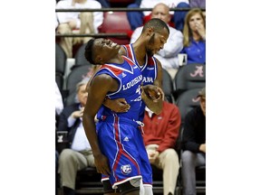 Louisiana Tech guard DaQuan Bracey (4) is helped off the court by Louisiana Tech guard Jacobi Boykins (0) during the first half of an NCAA college basketball game against Alabama, Wednesday, Nov. 29, 2017, in Tuscaloosa, Ala. (AP Photo/Butch Dill)