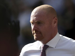 FILE - In this Sunday, Aug. 27, 2017 file photo, Burnley's manager Sean Dyche looks on during the English Premier League soccer match between Tottenham Hotspur and Burnley at Wembley stadium in London. Burnley is mixing it with the heavyweights of the Premier League despite being tipped for a season of struggle. The modest northwest team is tied on points with sixth-place Liverpool after 10 games and its manager Sean Dyche is being linked with the vacancy at Everton. (AP Photo/Tim Ireland, File)