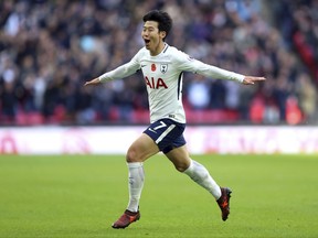 Tottenham Hotspur's Son Heung-Min celebrates scoring his side's first goal of the game, during the English Premier League soccer match between Tottenham Hotspur and Crystal Palace, at Wembley Stadium, in London, Sunday, Nov. 5, 2017. (Nigel French/PA via AP)