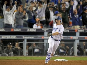 Joc Pederson of the Dodgers celebrates his home run against the Houston Astros during the seventh inning of Game 6 of the World Series on Tuesday night in Los Angeles.