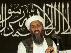 FILE - In this 1998 file photo made available on March 19, 2004, Osama bin Laden is seen at a news conference in Khost, Afghanistan. The CIA's release of documents seized during the 2011 raid that killed al-Qaida leader Osama bin Laden has again raised questions about Iran's support of the extremist network leading up to the Sept. 11 terror attacks. U.S. intelligence officials and prosecutors have long said Iran formed loose ties to the terror organization from 1991 on, something noted in a 19-page report in Arabic included in the release of some 47,000 other documents by the CIA. Iran always has denied any links. (AP Photo/Mazhar Ali Khan, File)